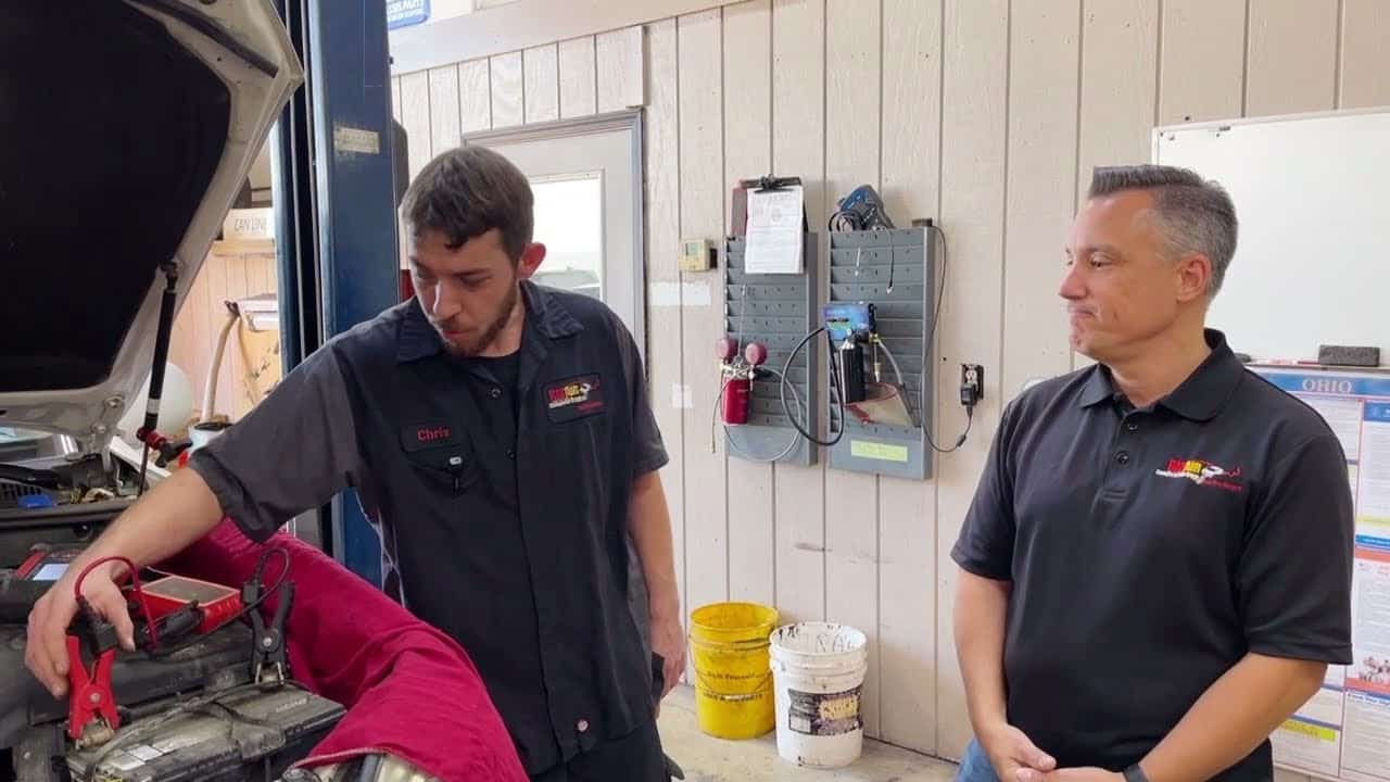 Car battery inspection at Rad Air Complete Car Care