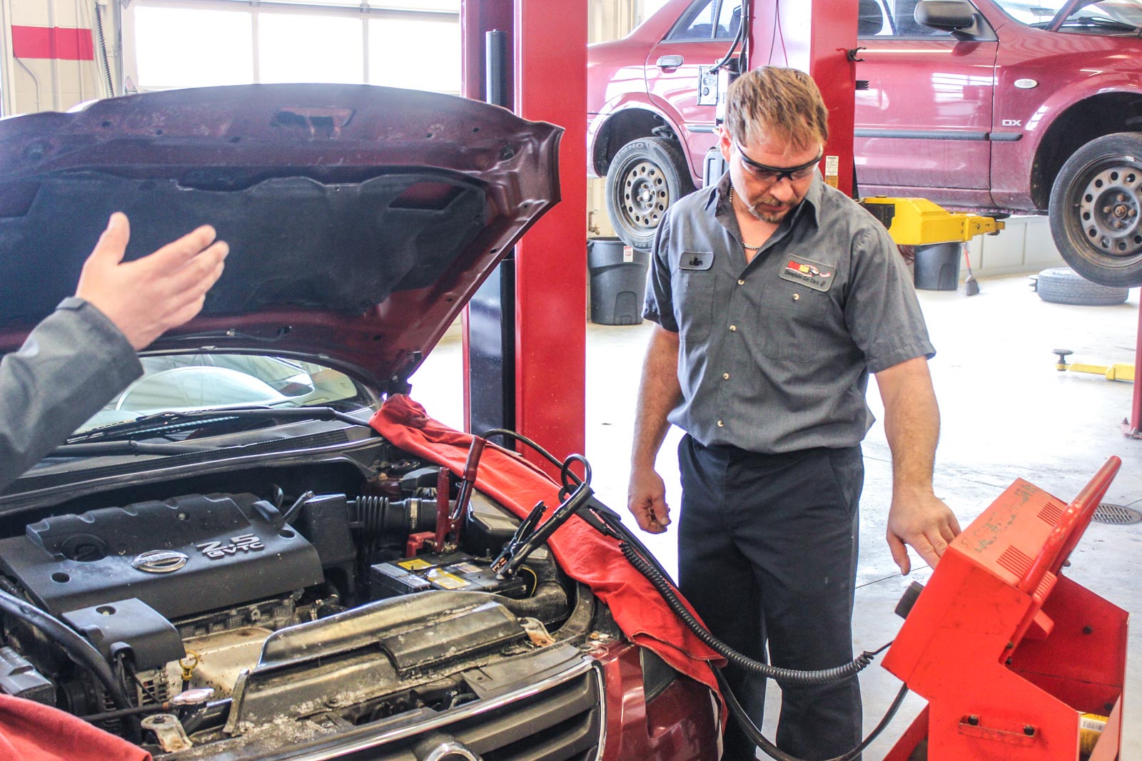 Battery testing and charging at Rad Air Complete Car Care