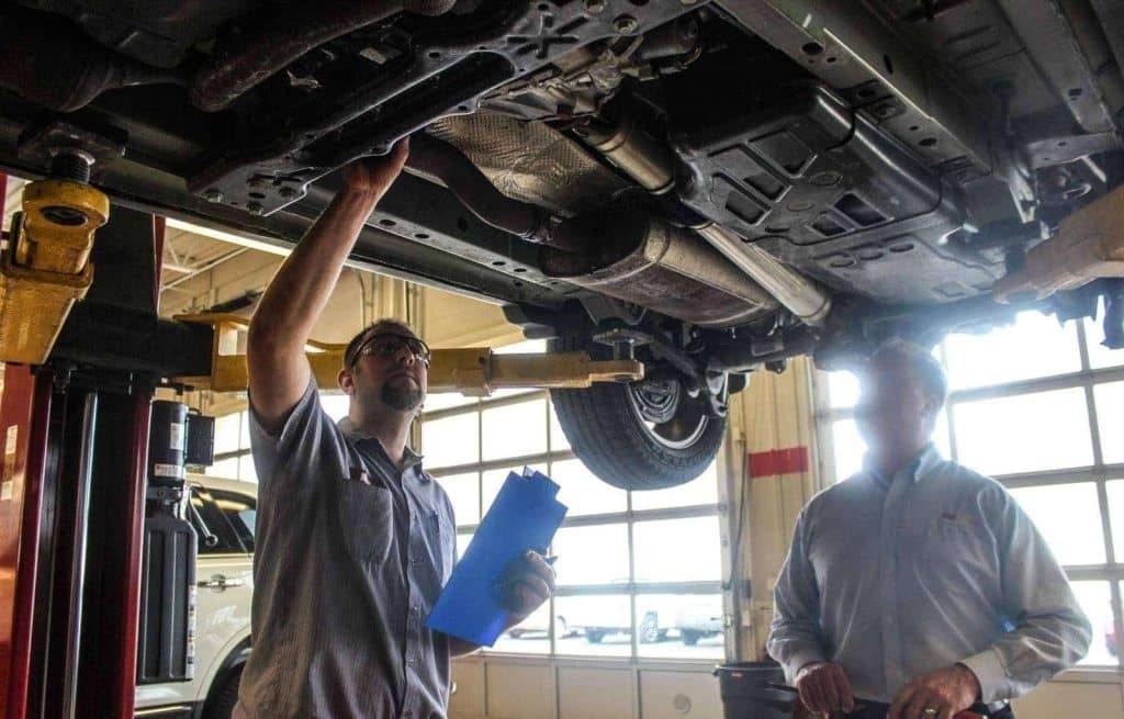 a mechanic inspecting a vehicle