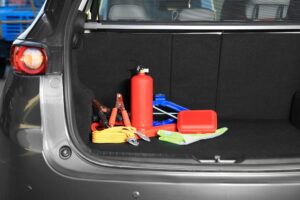 Set of car safety equipment in trunk space for text | Rad Air Complete Car Care Set of car safety equipment in trunk space for text
