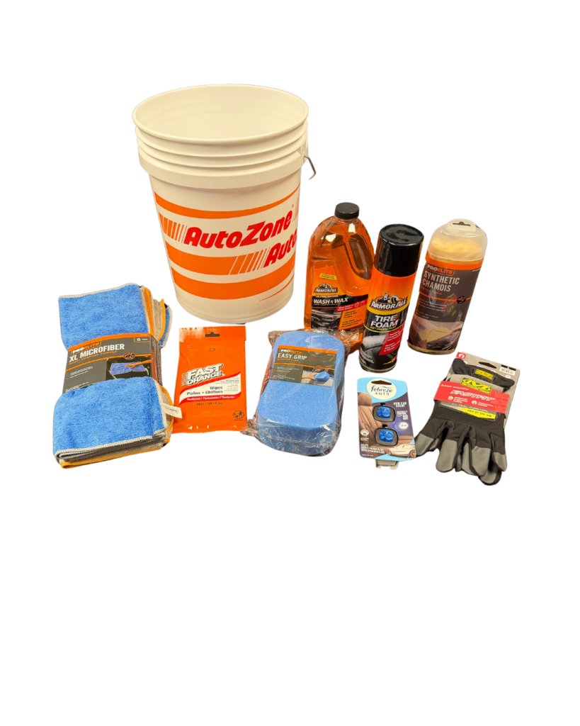 AutoZone bucket with car cleaning supplies, towels, and bottles arranged on a black background