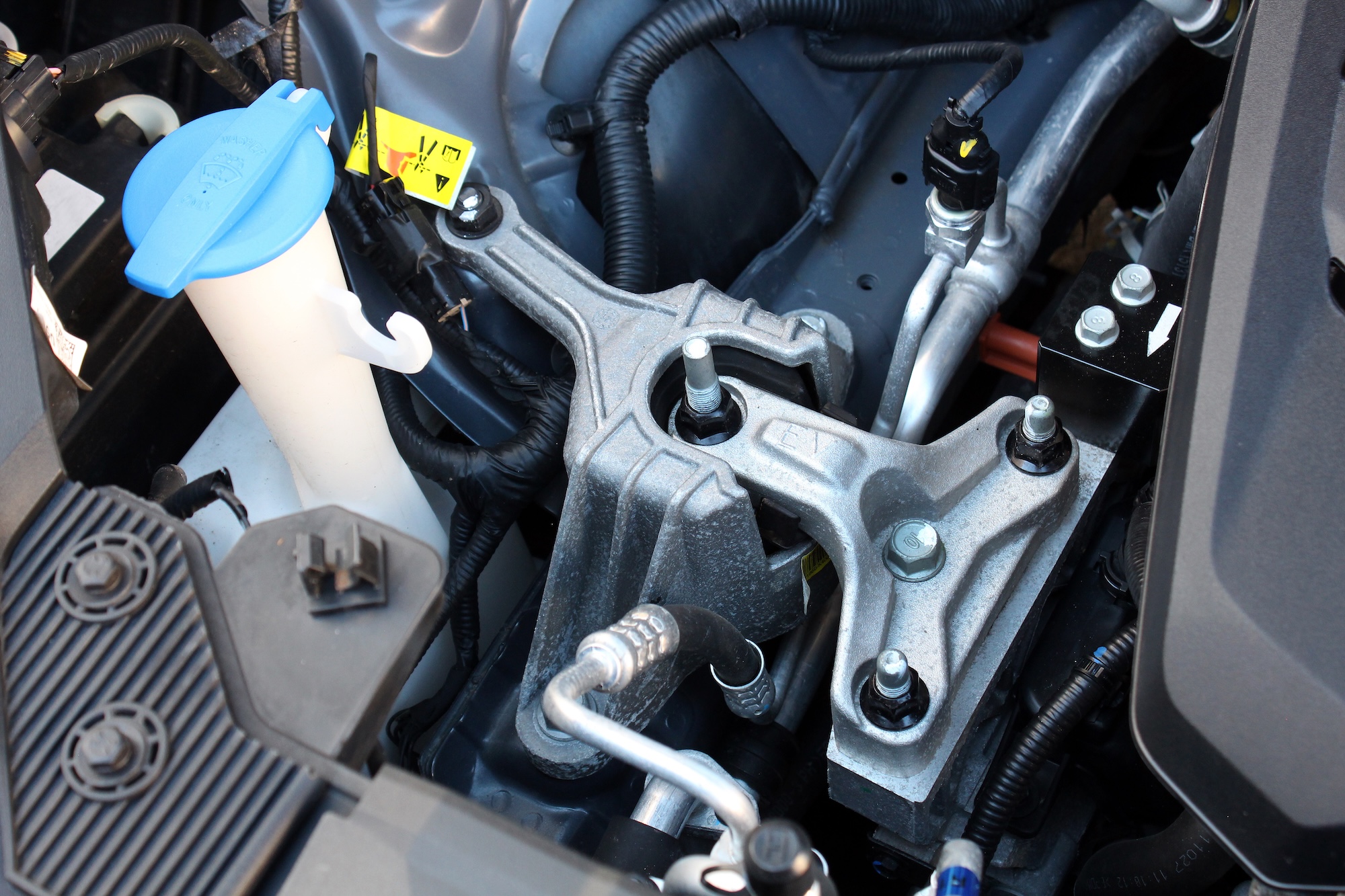 Close-up of an engine mount, the most common cause of car vibration at idle
